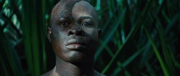 Movie still from “The Tempest” (2010), directed by Julie Taymor – A man with a face paint on his face; Close Up shot, Low angle