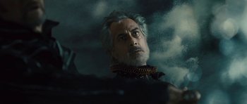 Movie still from “The Tempest” (2010), directed by Julie Taymor – A person wearing a necklace; Close Up shot, Low angle