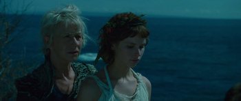 Movie still from “The Tempest” (2010), directed by Julie Taymor – A woman and a man standing next to each other; Close Up shot, Low angle