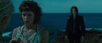 Movie still from “The Tempest” (2010), directed by Julie Taymor – A woman standing next to a man on the beach; Close Up shot, Over the shoulder angle