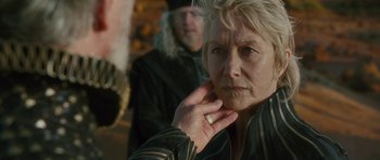 Movie still from “The Tempest” (2010), directed by Julie Taymor – An older woman is looking into the distance; Close Up shot, Over the shoulder angle