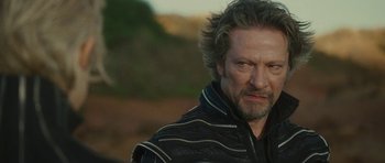 Movie still from “The Tempest” (2010), directed by Julie Taymor – A person wearing a jacket; Close Up shot, Over the shoulder angle