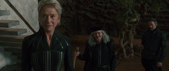 Movie still from “The Tempest” (2010), directed by Julie Taymor – Two older women walking in a cave with one holding a cane; Medium shot, Over the shoulder angle