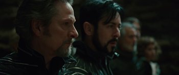 Movie still from “The Tempest” (2010), directed by Julie Taymor – Two men are sitting next to each other in a room; Close Up shot, Over the shoulder angle