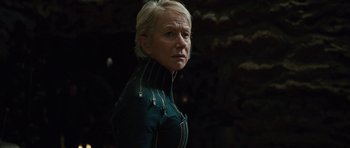 Movie still from “The Tempest” (2010), directed by Julie Taymor – A woman with blonde hair wearing a black jacket; Close Up shot, Low angle