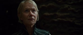 Movie still from “The Tempest” (2010), directed by Julie Taymor – An older woman with blonde hair looking at the camera; Close Up shot, Low angle