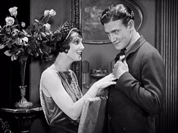 Movie still from “The Ten Commandments” (1923), directed by Cecil B. DeMille – An old photo of a man and a woman; Medium shot, Low angle