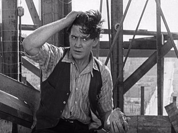 Movie still from “The Ten Commandments” (1923), directed by Cecil B. DeMille – A man in a striped shirt and a striped tie; Medium shot, Low angle