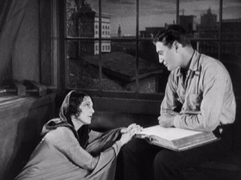 Movie still from “The Ten Commandments” (1923), directed by Cecil B. DeMille – An old photo of a man and a woman holding hands; Medium shot, Low angle