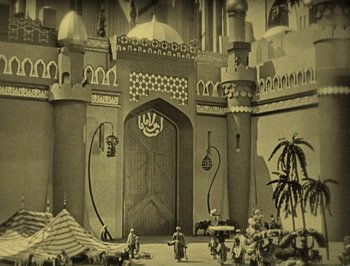 Movie still from “The Thief of Bagdad” (1924), directed by Raoul Walsh – A black and white photo of a toy castle; Extreme Wide shot, High angle