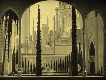Movie still from “The Thief of Bagdad” (1924), directed by Raoul Walsh – An old photo of a city with a castle in the background; Extreme Wide shot, High angle