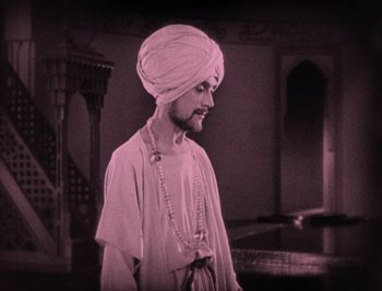 Movie still from “The Thief of Bagdad” (1924), directed by Raoul Walsh – A man with a turban and a long beard; Medium shot, Low angle
