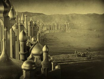 Movie still from “The Thief of Bagdad” (1924), directed by Raoul Walsh – An old photo of a city with a castle like structure; Extreme Wide shot, High angle
