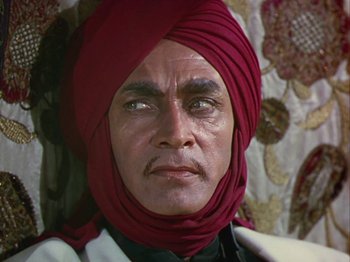 Movie still from “The Thief of Bagdad” (1940), directed by Alexander Korda – A person wearing a turban; Close Up shot, Low angle