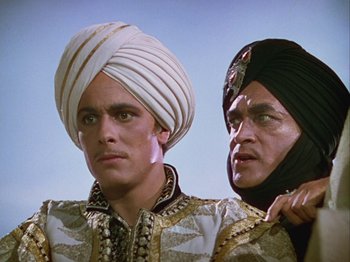 Movie still from “The Thief of Bagdad” (1940), directed by Alexander Korda – Two men in traditional clothing are posing for a picture; Close Up shot, Low angle