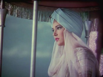 Movie still from “The Thief of Bagdad” (1940), directed by Alexander Korda – A woman with a turban on her head; Medium shot, Low angle