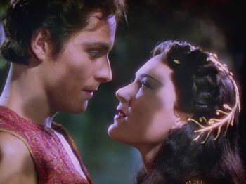 Movie still from “The Thief of Bagdad” (1940), directed by Alexander Korda – A man and a woman face to face in a forest; Close Up shot, Over the shoulder angle