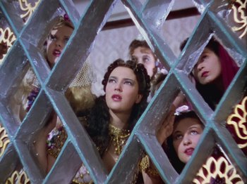 Movie still from “The Thief of Bagdad” (1940), directed by Alexander Korda – A group of women standing next to each other in a room; Medium shot, Low angle