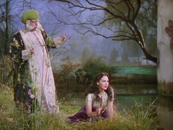 Movie still from “The Thief of Bagdad” (1940), directed by Alexander Korda – A painting of an old man and a young girl; Wide shot, High angle