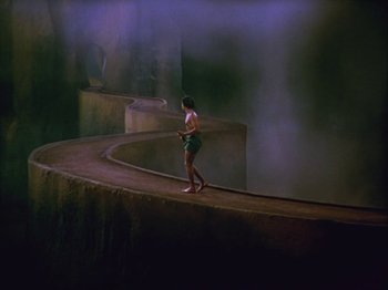 Movie still from “The Thief of Bagdad” (1940), directed by Alexander Korda – A woman is walking on a path in the fog; Extreme Wide shot, High angle