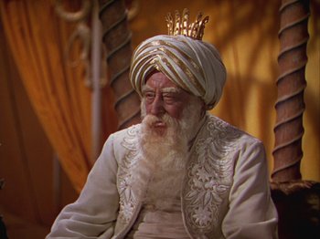 Movie still from “The Thief of Bagdad” (1940), directed by Alexander Korda – An old man with a beard and a turban on his head; Close Up shot, Low angle
