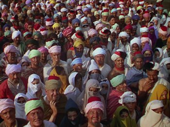 Movie still from “The Thief of Bagdad” (1940), directed by Alexander Korda – A large group of people wearing turbans and scarves; Wide shot, High angle