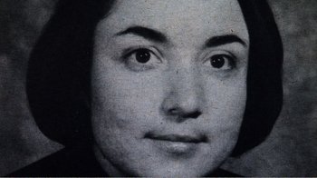 Movie still from “The Thin Blue Line” (1988), directed by Errol Morris – An old black and white photo of a woman's face; Extreme Close Up shot, High angle