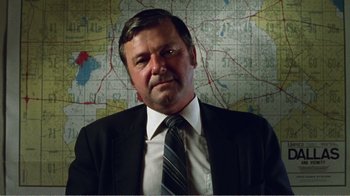 Movie still from “The Thin Blue Line” (1988), directed by Errol Morris – A person wearing a suit and tie; Close Up shot, Low angle