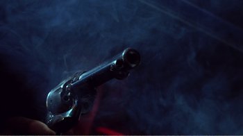 Movie still from “The Thin Blue Line” (1988), directed by Errol Morris – The barrel of an old gun; Extreme Close Up shot, Low angle