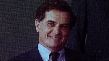 Movie still from “The Thin Blue Line” (1988), directed by Errol Morris – A man wearing a suit and tie smiling for the camera; Close Up shot, High angle
