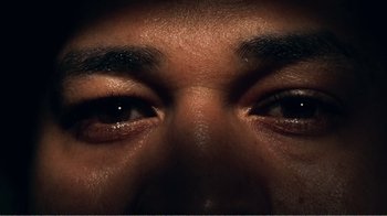 Movie still from “The Thin Blue Line” (1988), directed by Errol Morris – View of a person's eyes; Extreme Close Up shot, Overhead angle