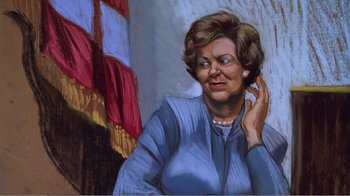 Movie still from “The Thin Blue Line” (1988), directed by Errol Morris – An older woman is holding her hand up to her ear; Close Up shot, Low angle