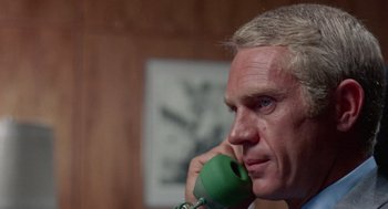 Movie still from “The Thomas Crown Affair” (1968), directed by Norman Jewison – A person talking on a phone; Close Up shot, Low angle