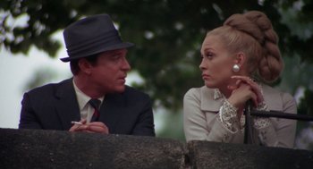 Movie still from “The Thomas Crown Affair” (1968), directed by Norman Jewison – A man and a woman sitting next to each other; Close Up shot, Low angle