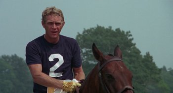 Movie still from “The Thomas Crown Affair” (1968), directed by Norman Jewison – A man riding on the back of a brown horse; Close Up shot, Over the shoulder angle