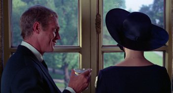 Movie still from “The Thomas Crown Affair” (1968), directed by Norman Jewison – A man and a woman are drinking wine together; Close Up shot, Over the shoulder angle