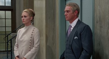 Movie still from “The Thomas Crown Affair” (1968), directed by Norman Jewison – A man and a woman standing next to each other; Medium shot, Low angle