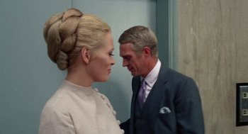 Movie still from “The Thomas Crown Affair” (1968), directed by Norman Jewison – A man and a woman standing next to each other; Close Up shot, Over the shoulder angle