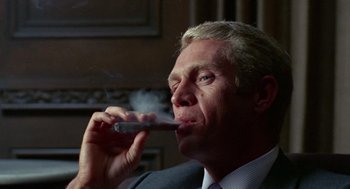 Movie still from “The Thomas Crown Affair” (1968), directed by Norman Jewison – A person smoking a cigarette; Close Up shot, Low angle