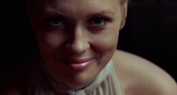 Movie still from “The Thomas Crown Affair” (1968), directed by Norman Jewison – A woman's face , smiling for the camera; Close Up shot, Over the shoulder angle