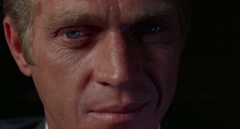Movie still from “The Thomas Crown Affair” (1968), directed by Norman Jewison – An older man with blue eyes looking at the camera; Extreme Close Up shot, Low angle