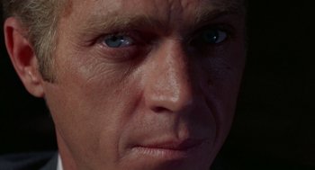 Movie still from “The Thomas Crown Affair” (1968), directed by Norman Jewison – A man's face with blue eyes; Extreme Close Up shot, High angle
