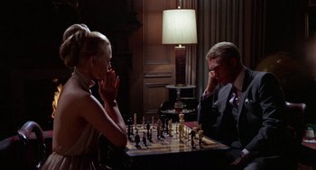 Movie still from “The Thomas Crown Affair” (1968), directed by Norman Jewison – A man and a woman are playing a game of chess; Close Up shot, Over the shoulder angle