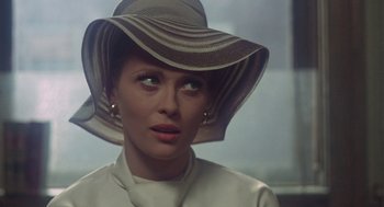 Movie still from “The Thomas Crown Affair” (1968), directed by Norman Jewison – A person wearing a hat; Close Up shot, Over the shoulder angle