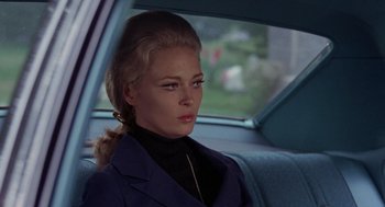 Movie still from “The Thomas Crown Affair” (1968), directed by Norman Jewison – A woman sitting in the back seat of a car; Close Up shot, Over the shoulder angle