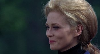 Movie still from “The Thomas Crown Affair” (1968), directed by Norman Jewison – A woman with blonde hair; Close Up shot, Over the shoulder angle