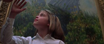 Movie still from “The Thomas Crown Affair” (1999), directed by John McTiernan – A young girl looking up into the sky; Close Up shot, Low angle
