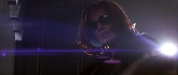 Movie still from “The Thomas Crown Affair” (1999), directed by John McTiernan – A person wearing sunglasses; Close Up shot, Low angle