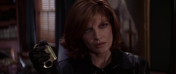 Movie still from “The Thomas Crown Affair” (1999), directed by John McTiernan – A person wearing a leather jacket; Close Up shot, Low angle