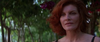 Movie still from “The Thomas Crown Affair” (1999), directed by John McTiernan – A person with red curly hair; Close Up shot, Low angle